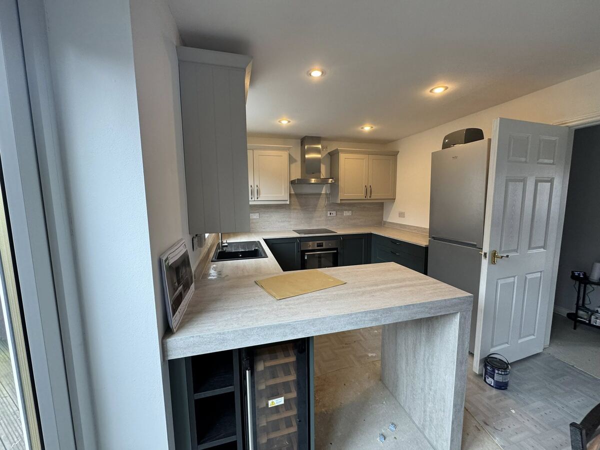 Grey kitchen with breakfast bar fitted by W.B Joinery & Kitchens in the North East